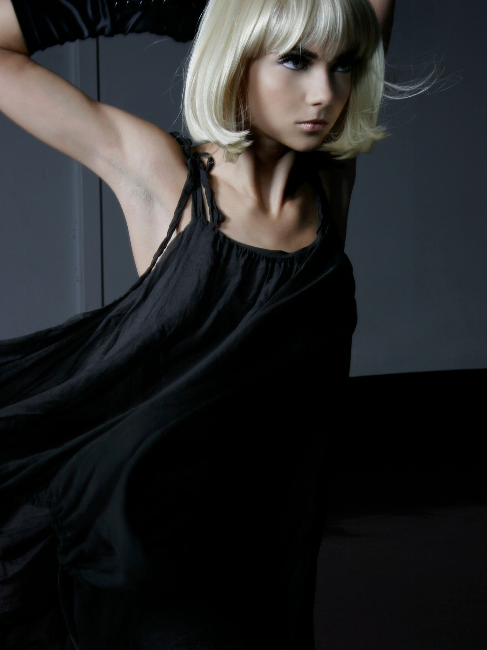 Fashion direction portrait with a sculptural silhouette.